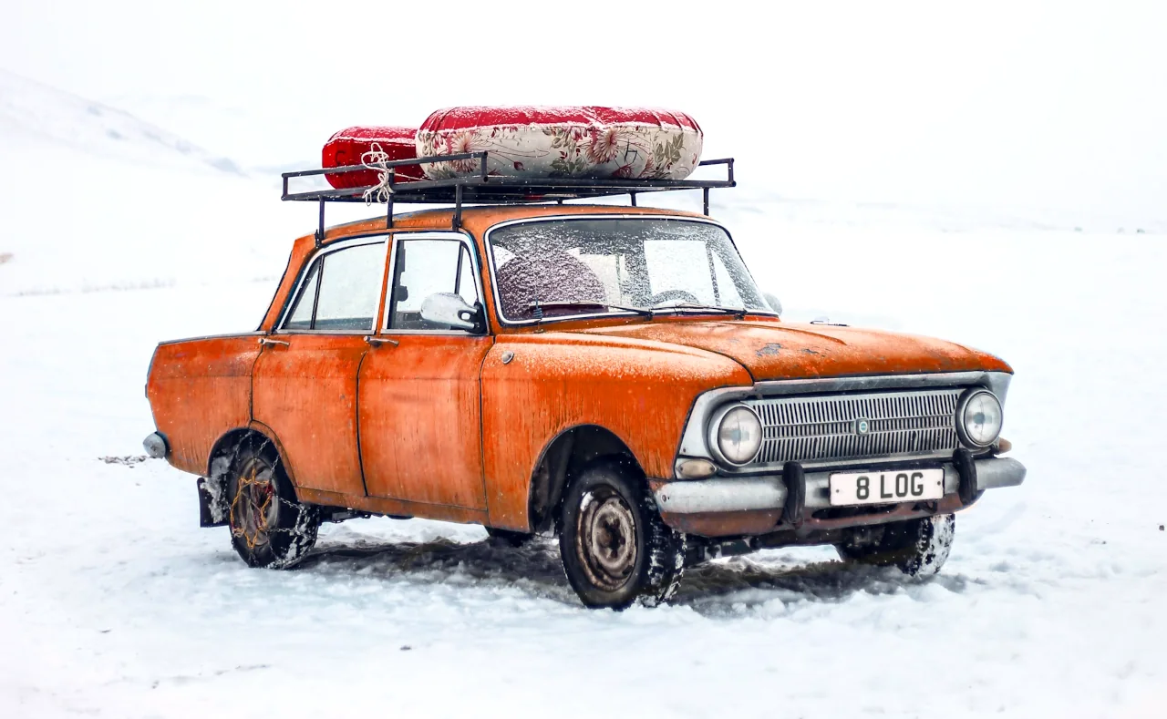 An orange car with number plate spelling the word BLOG